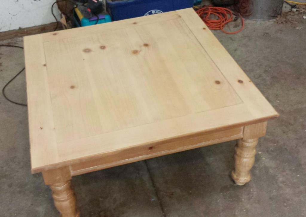 The square table, once covered with child graffiti, now sanded to pristine perfection.